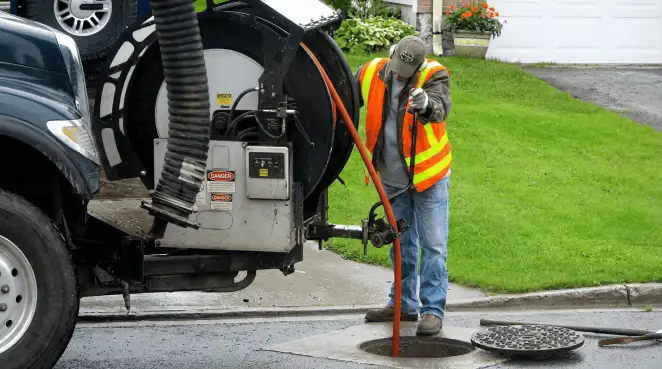 Technician using specialized drainage equipment for sewer line cleaning and foundation protection in Mobile, AL